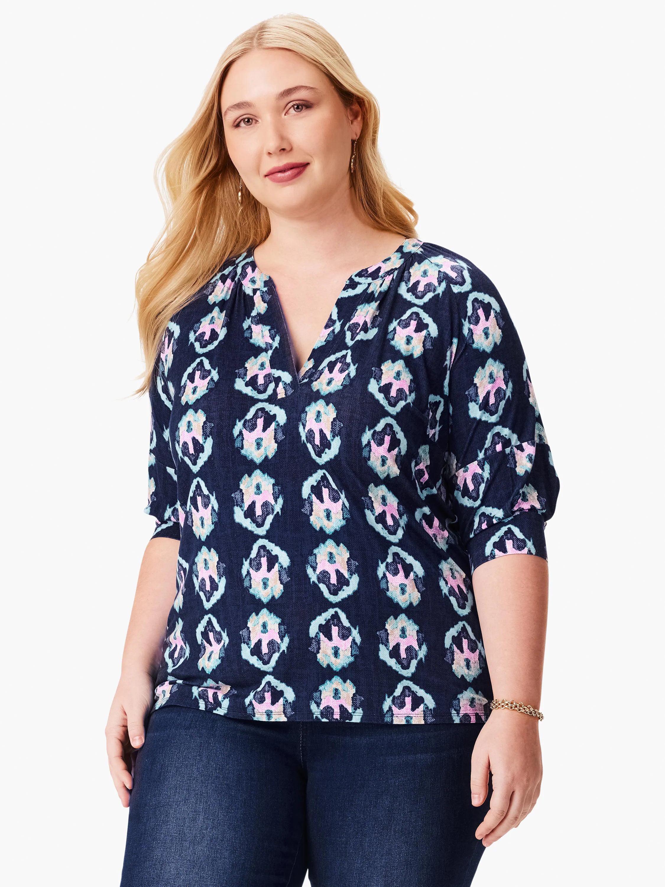 Navy blue top with teal, pink, and beige batik pattern.  Three-quarter sleeves, V-neck.