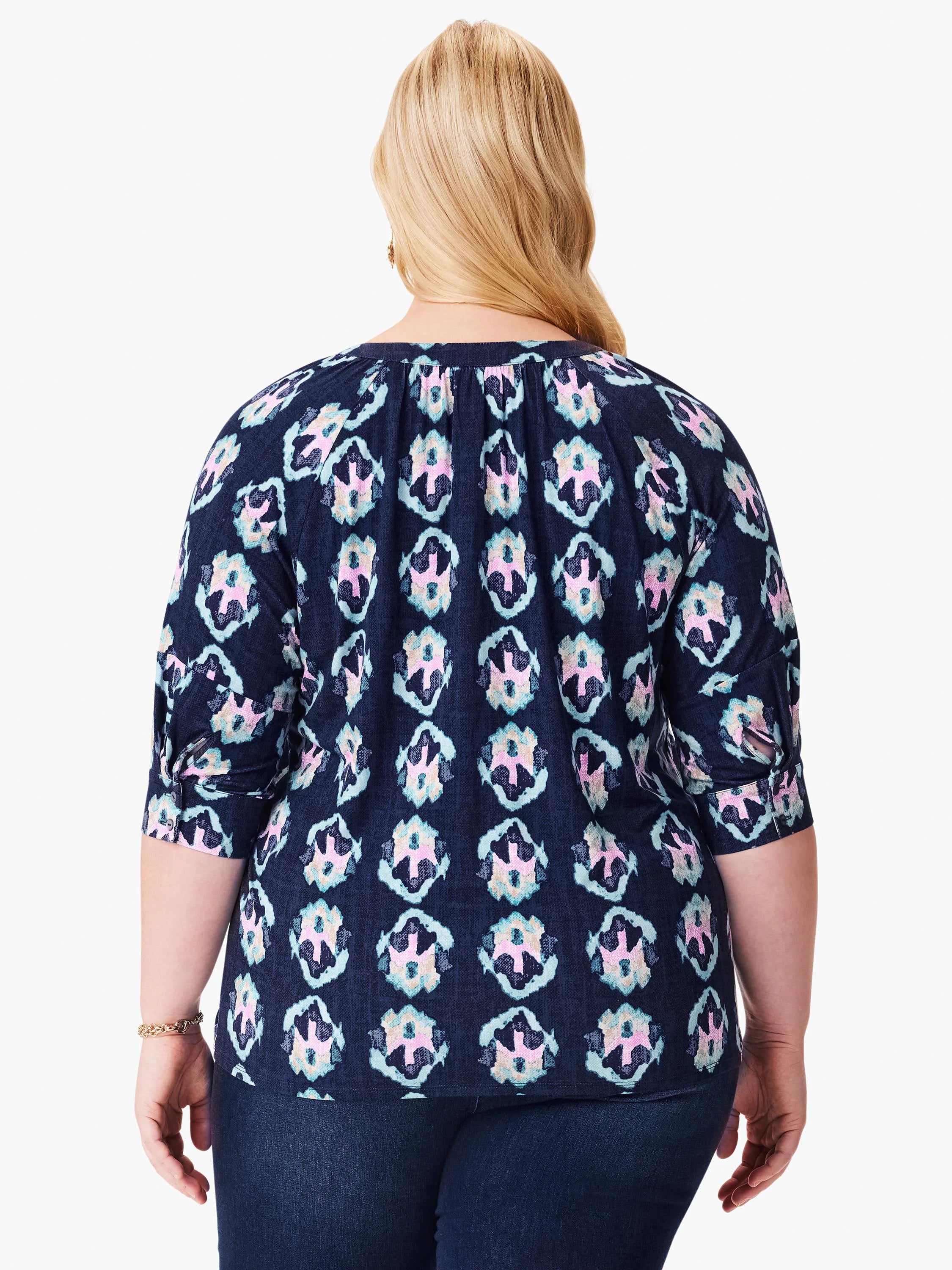 Dark navy top with teal, pink, and beige batik pattern. Three-quarter sleeves.  Back view.