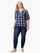 Navy blue top with teal, pink & white batik pattern; 3/4 sleeves; V-neck.