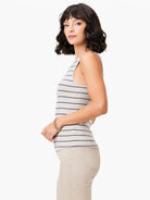 Beige tank top with thin, dark blue horizontal stripes; high neck, sleeveless.