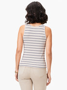 Beige tank top with thin, dark blue horizontal stripes; high neck, sleeveless.
