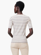 Cream-colored shirt with thin navy blue horizontal stripes, short sleeves, and a boatneck.