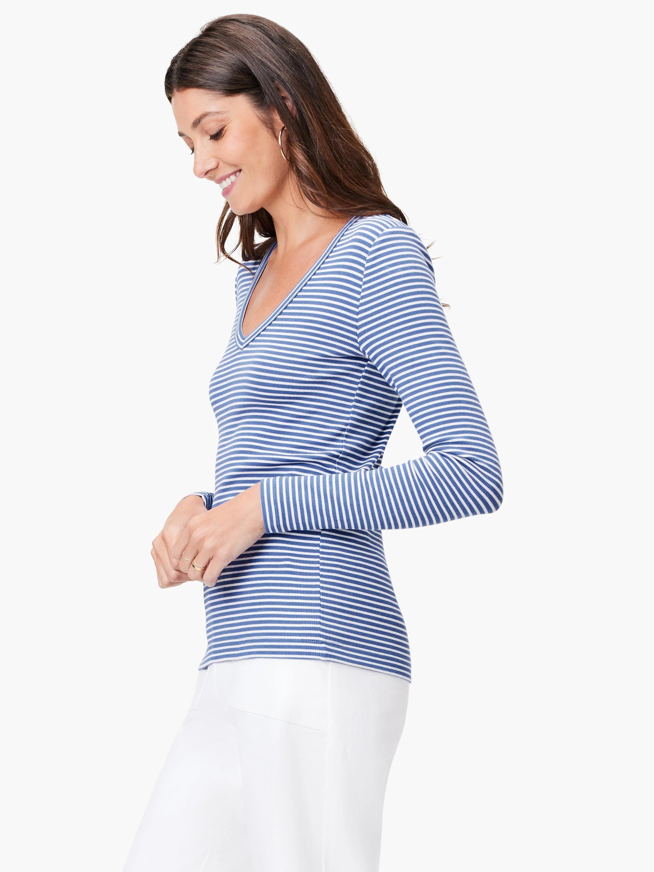 Blue and white striped, long-sleeved V-neck shirt; ribbed knit texture.