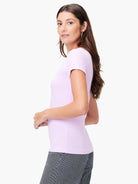 Pale pink, ribbed knit short sleeve crew tee, close-fitting.