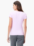 Light purple ribbed knit short sleeve crew neck tee. View from the back on a model.