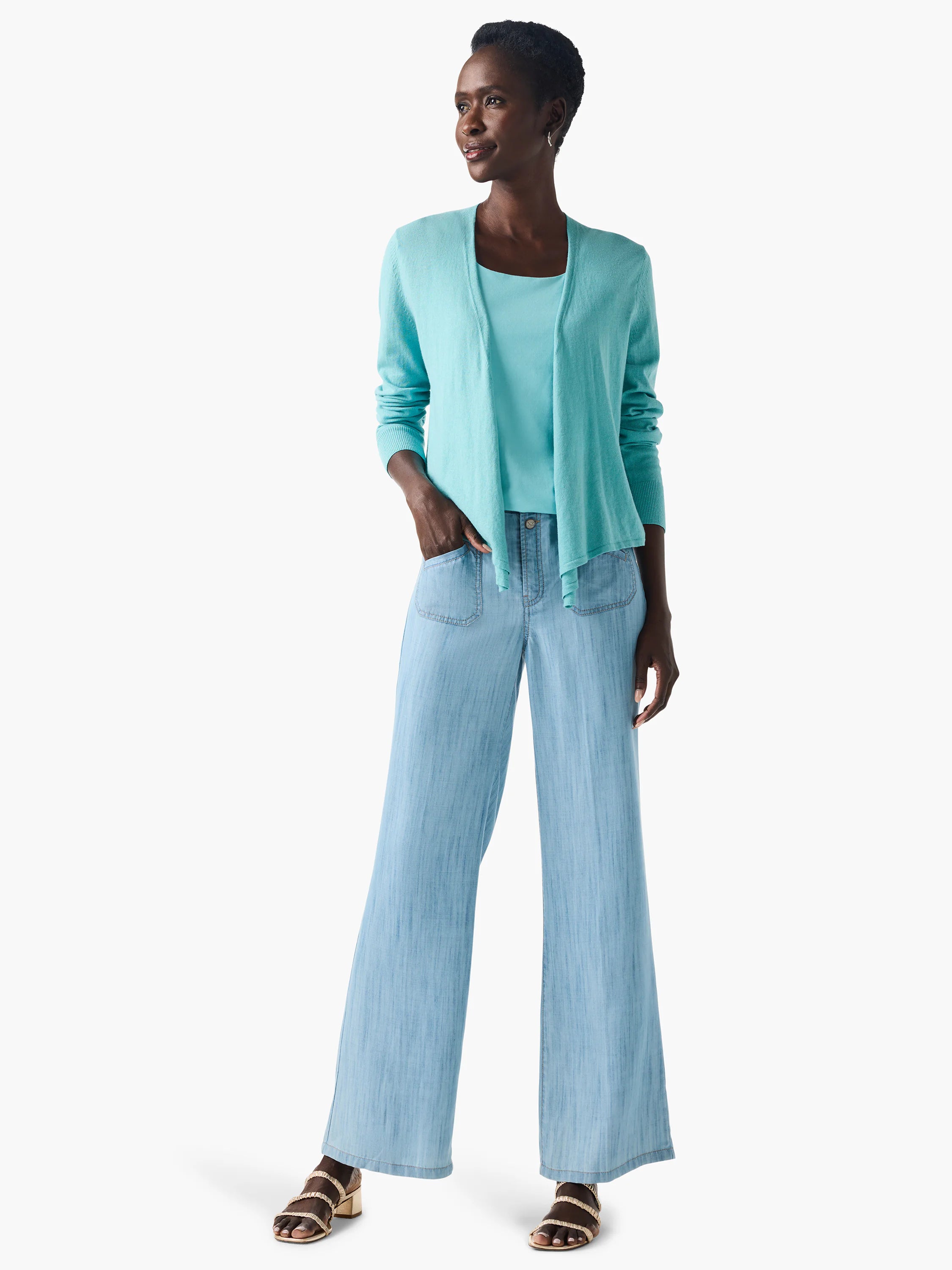 Aqua sleeveless scoop neck tank, partially seen on a model under an open cardigan.