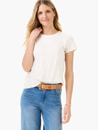 Off-white lace-knit t-shirt with short sleeves.