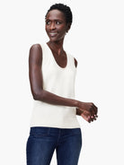 Off-white cotton knit tank top, sleeveless, scoop neck.