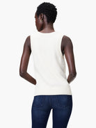 Off-white cotton sleeveless knit tank, ribbed trim.  Shown from the back.