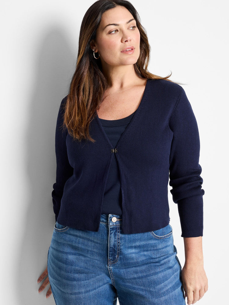 Navy ribbed knit cardigan with a V-neck, long sleeves, and a single gold-toned butterfly clasp at the chest.