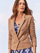 Beige textured knit jacket, double-breasted with silver buttons and patch pockets.