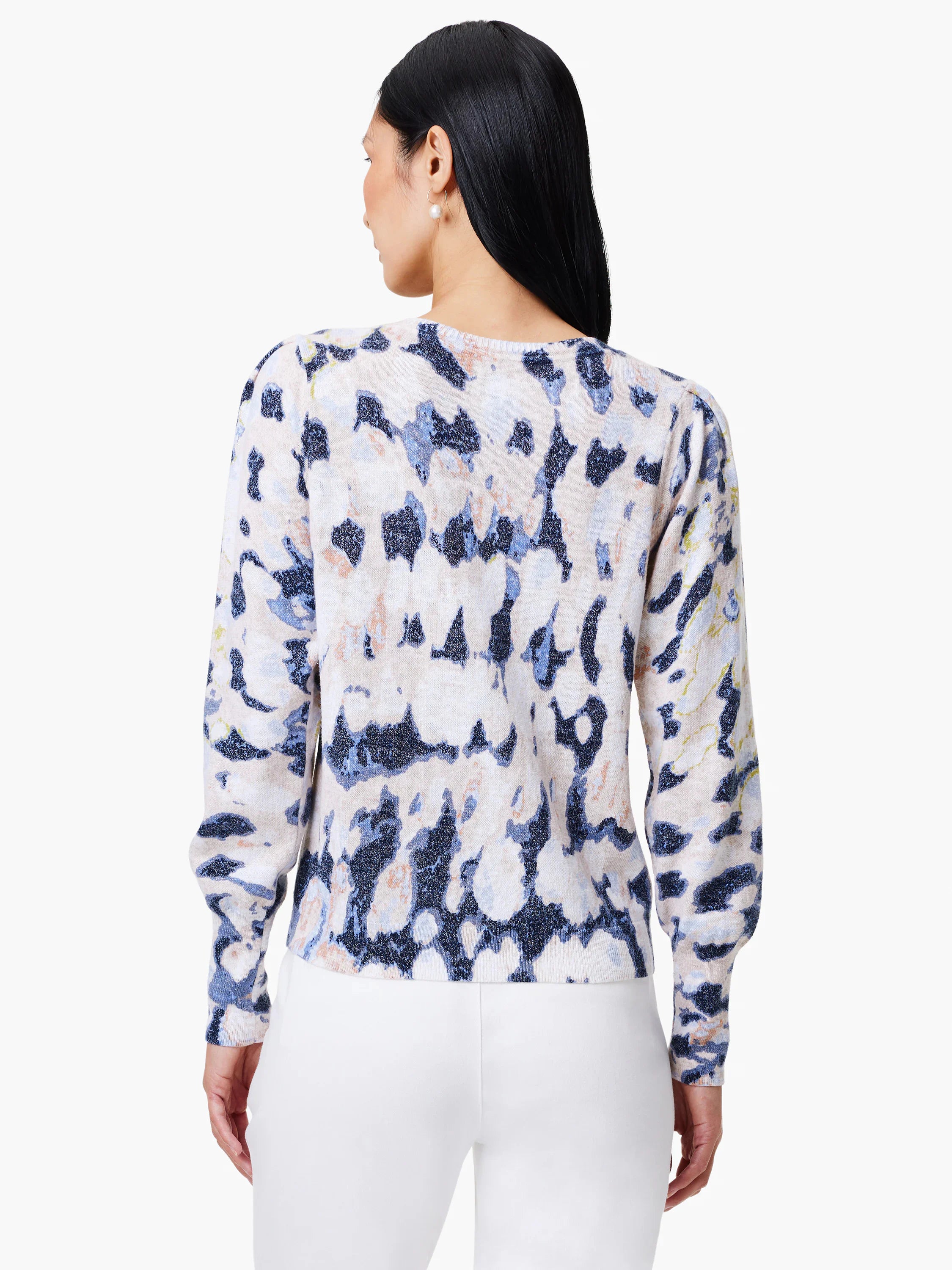 Beige sweater with blue and purple abstract print.  Long sleeves, slightly puffed shoulders.