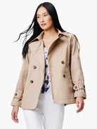 Beige double-breasted trench coat with brown buttons and cuffed sleeves.