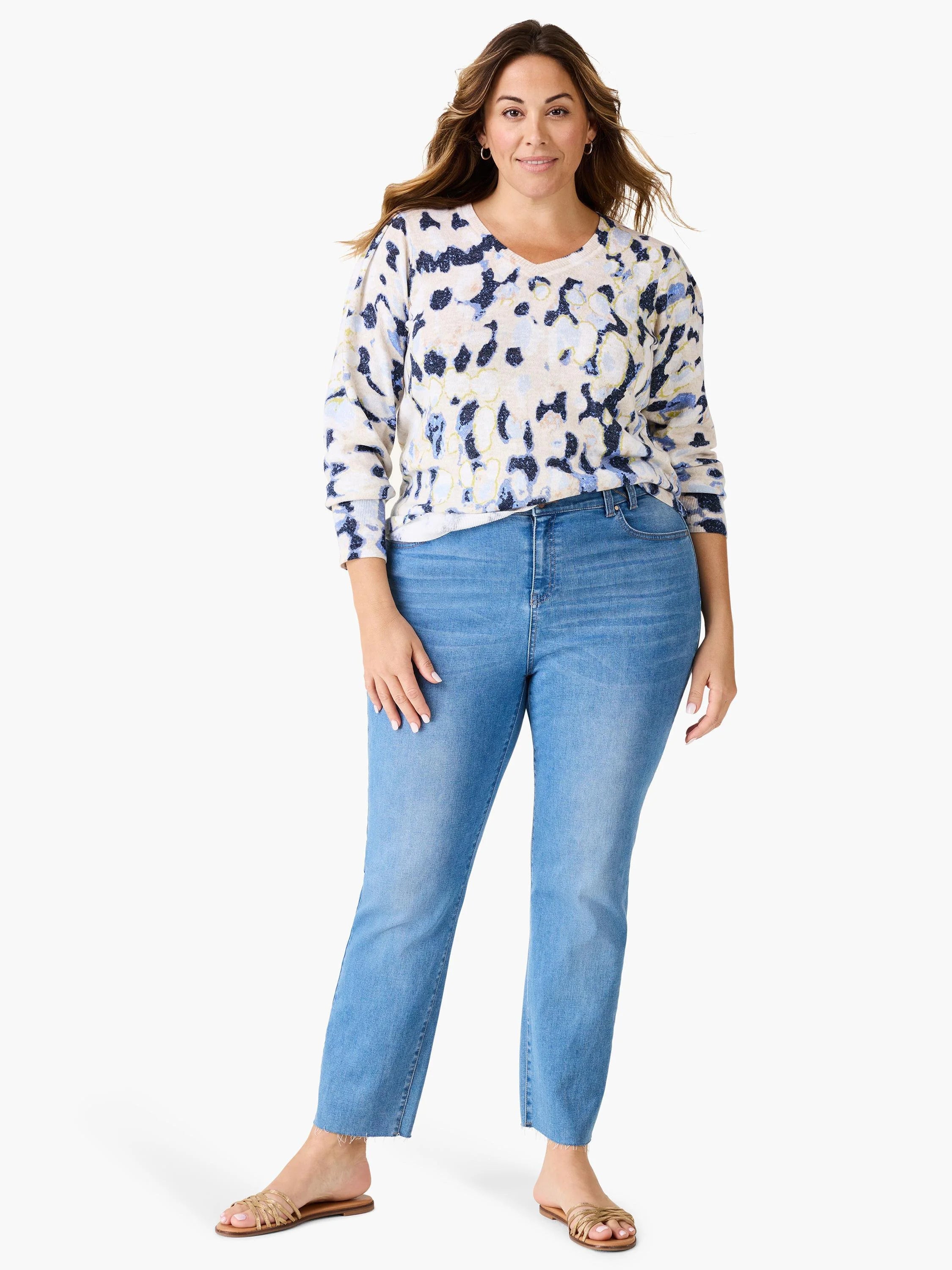 Cream-colored sweater with blue and darker blue abstract print. Long sleeves, V-neck.