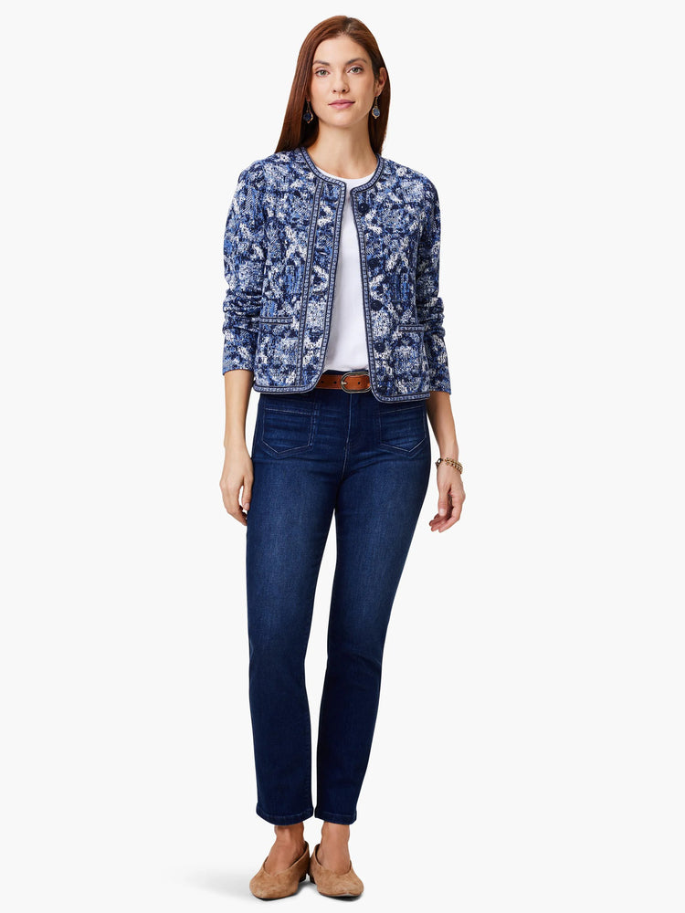 Indigo blue knit jacket with a geo pattern, white accents, and button front.
