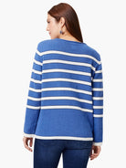 Blue sweater with white horizontal stripes and white cuffs.  Long sleeves.