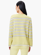 Pale yellow knit sweater with thin white and dark stripes.  Features a ribbed hem and cuffs with a white and dark trim.