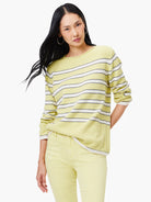 Pale yellow sweater with white and navy blue horizontal stripes, long sleeves, and a boat neck.