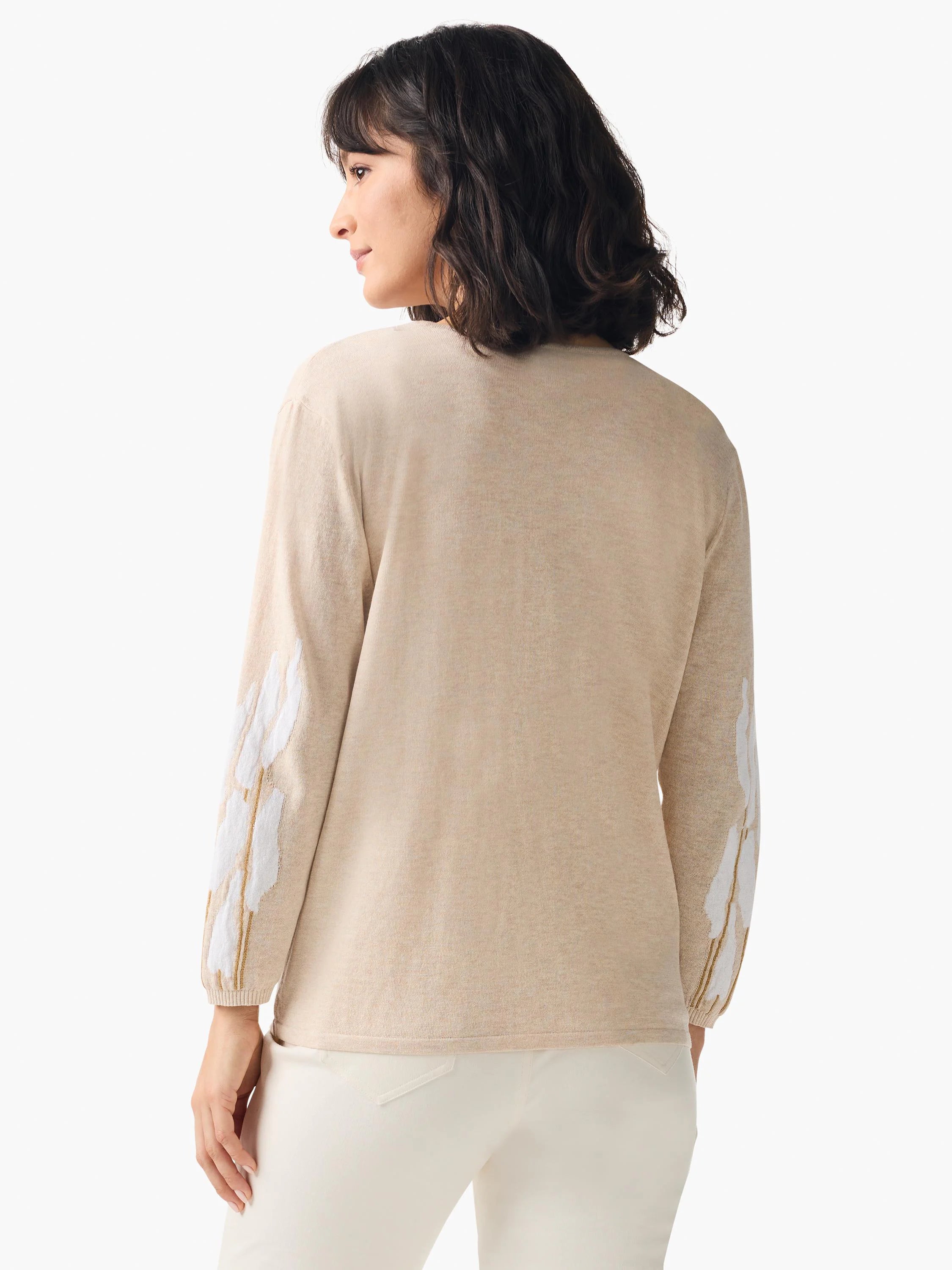 Beige cardigan, long sleeves. White and gold floral embroidery on sleeves.