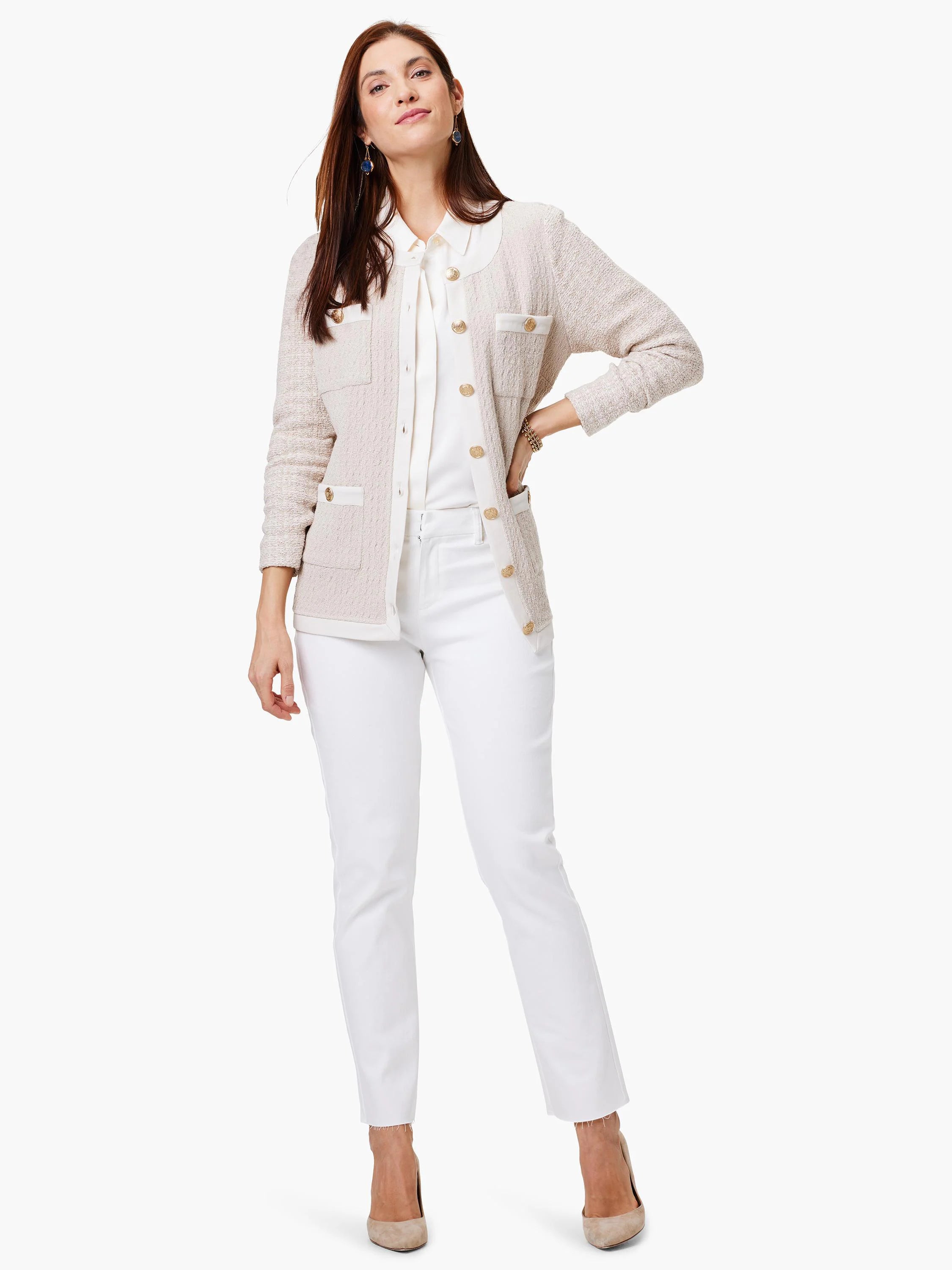 Beige knit jacket with white trim, gold buttons, and patch pockets.