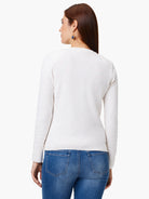 Off-white long-sleeve cardigan, shown from the back.  The model is wearing blue jeans.