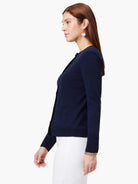 Navy blue cardigan, long sleeves, button front, and small pocket.