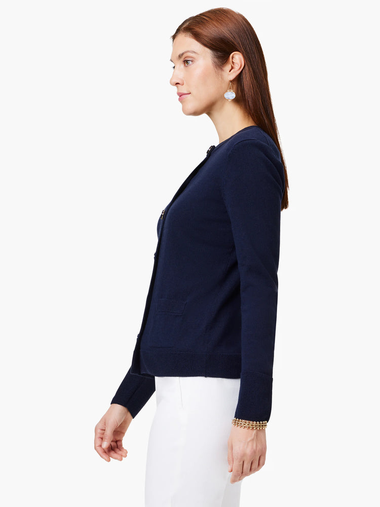 Navy blue cardigan, long sleeves, button front, and small pocket.