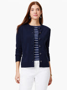 Navy blue cardigan, front button closure, two pockets.  Features dark buttons.