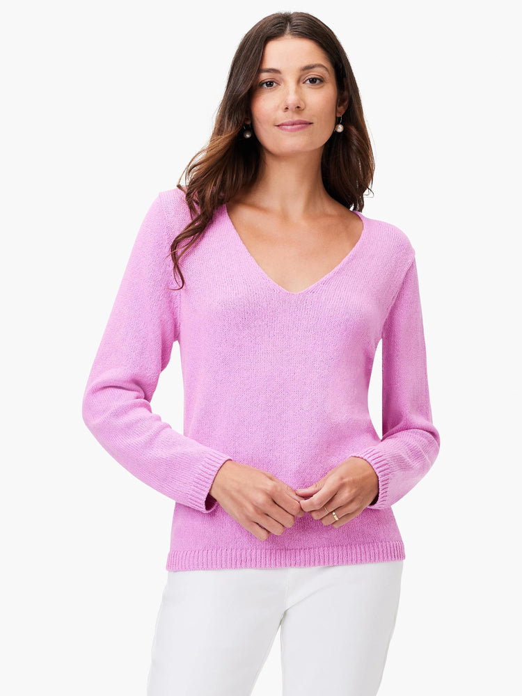 Light pink knit V-neck sweater with long sleeves and ribbed cuffs/hem.