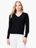 Black slub knit v-neck sweater with long sleeves.