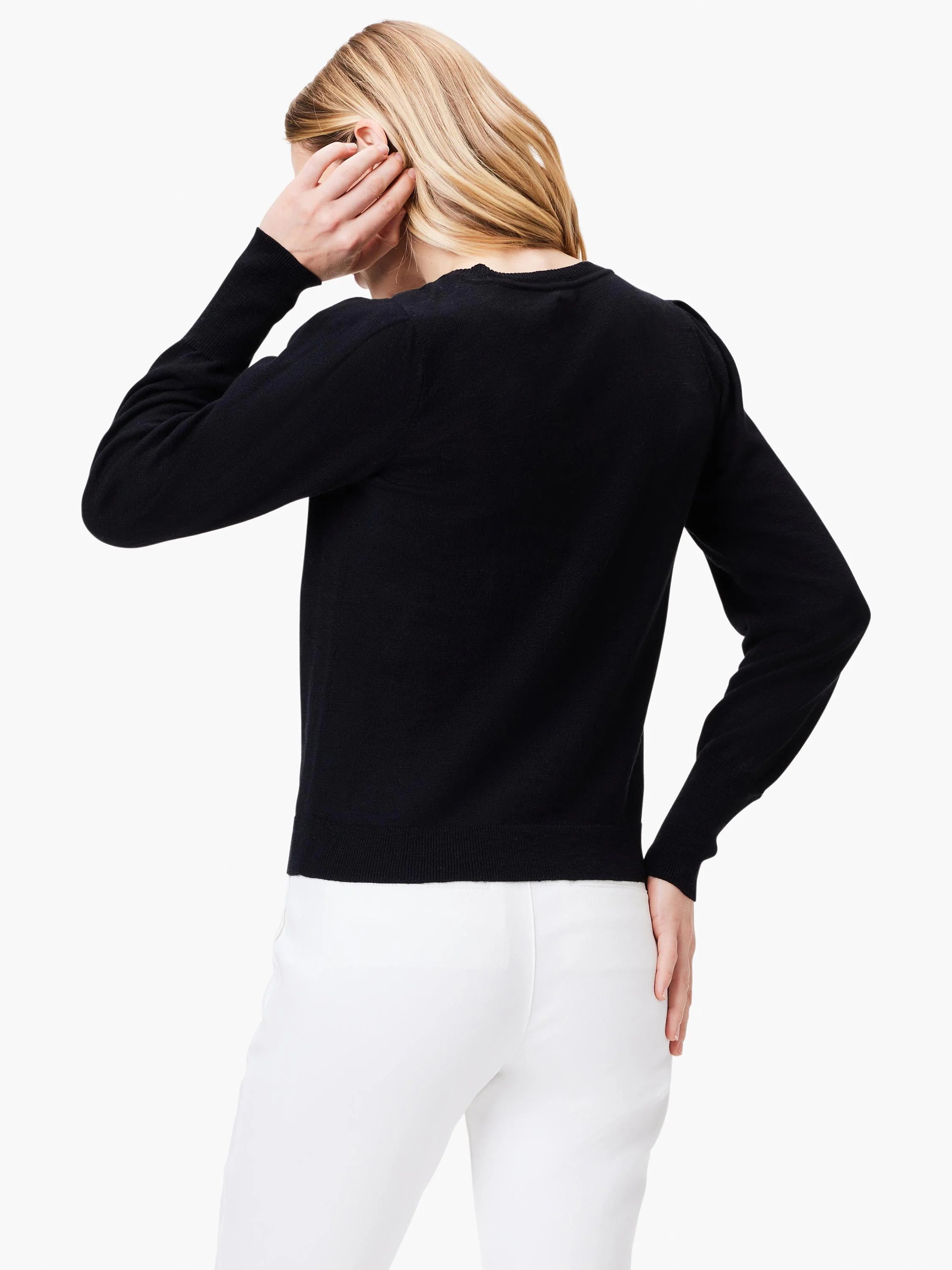 Black slub knit V-neck sweater; long sleeves.  Rear view.