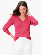 Pink slub V-neck sweater, long sleeves, and a relaxed fit.