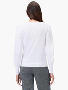 White slub v-neck sweater with long sleeves.  The back view shows a slightly puffed sleeve detail.