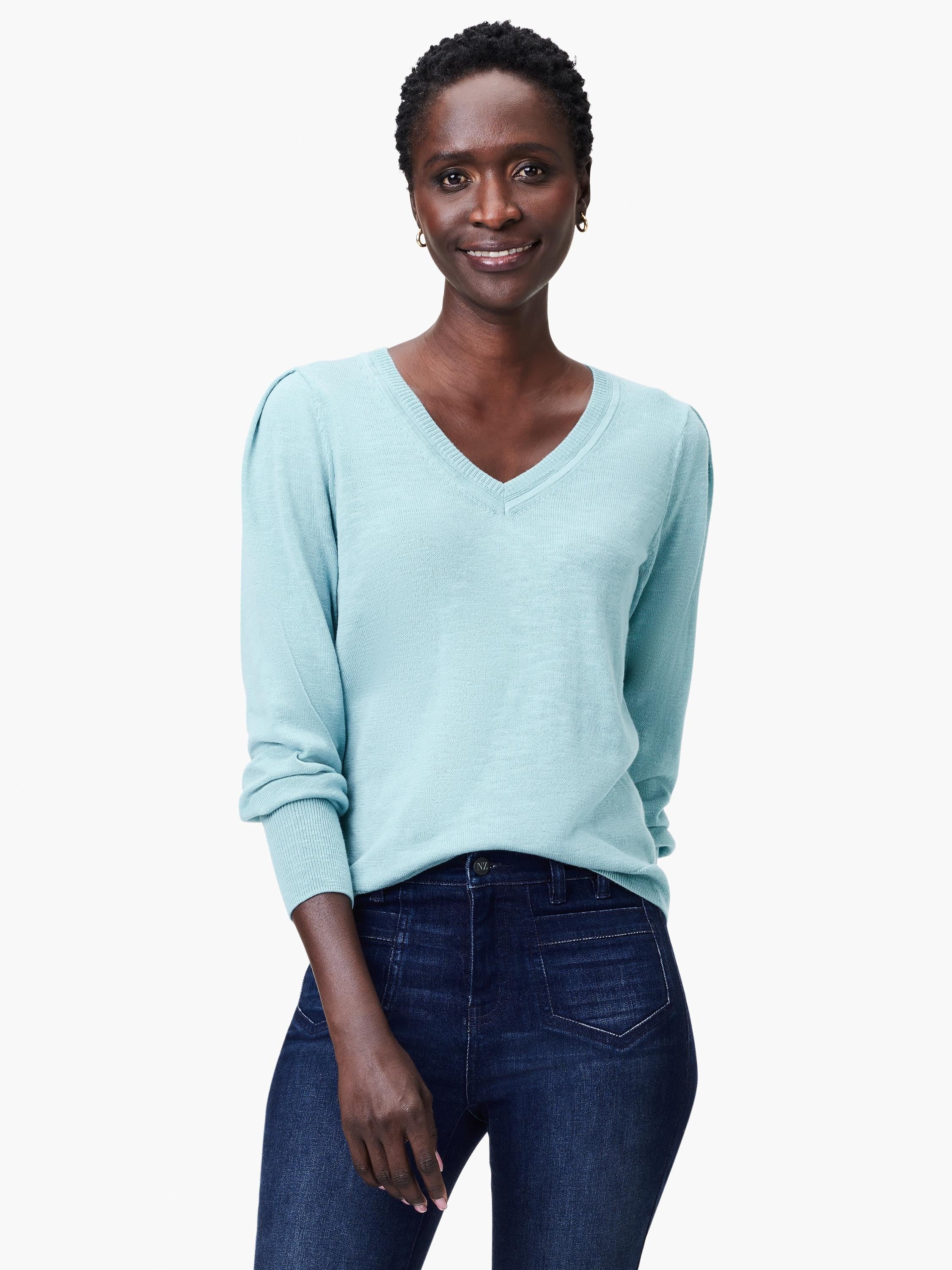 Light blue slub knit V-neck sweater, long sleeves.