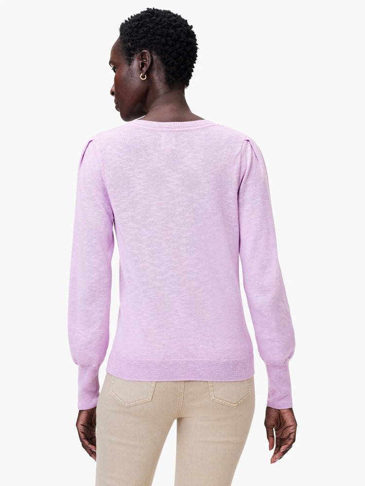 Lilac slub knit V-neck sweater, long sleeves, slightly puffed shoulders.  Back view.
