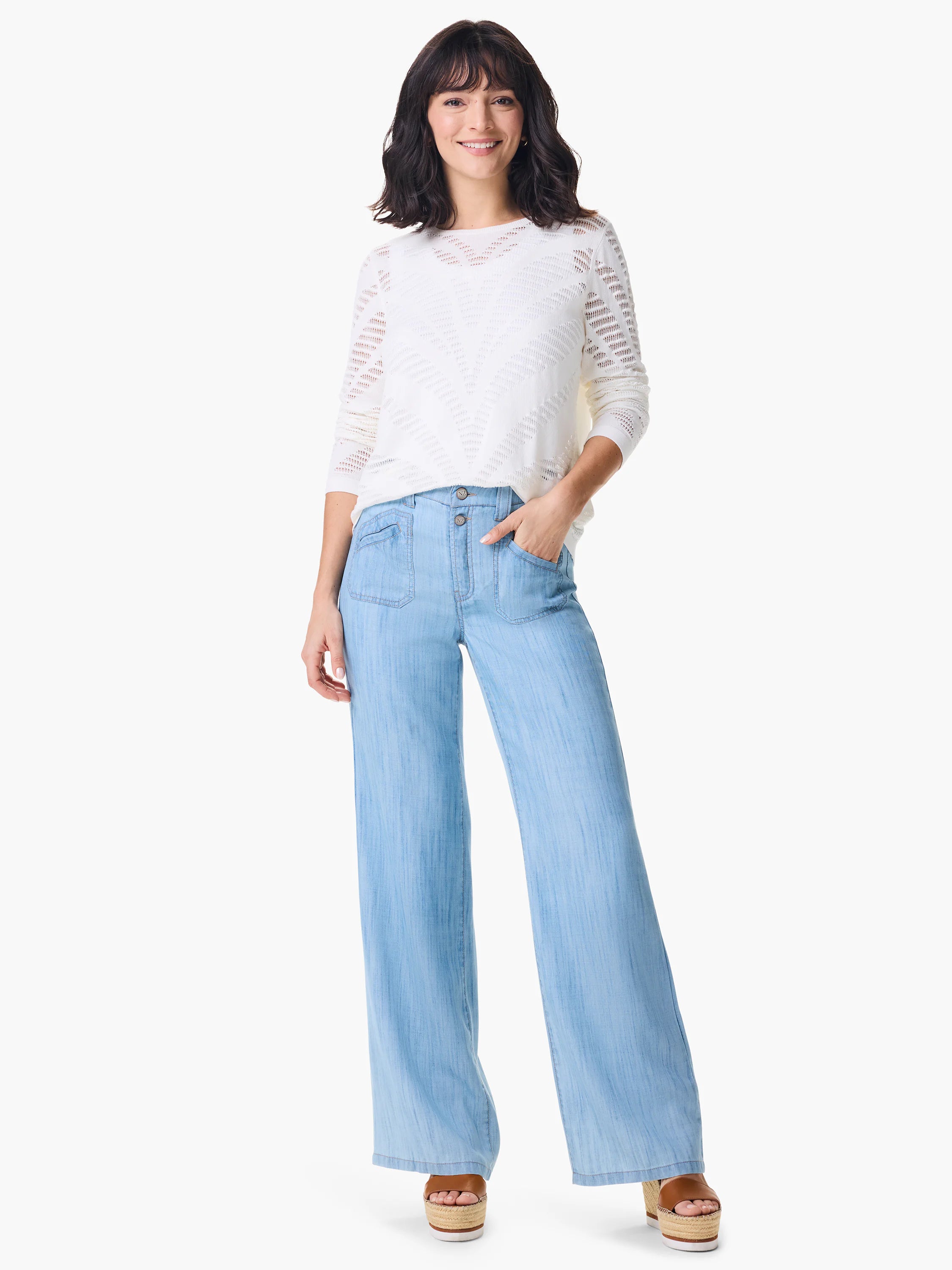 White pointelle-knit sweater with a textured, chevron-like pattern.  Off-white background.