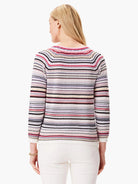 Horizontal striped sweater.  Colors:  off-white, pink, purple, black, beige.  Three-quarter sleeves, boat neck.