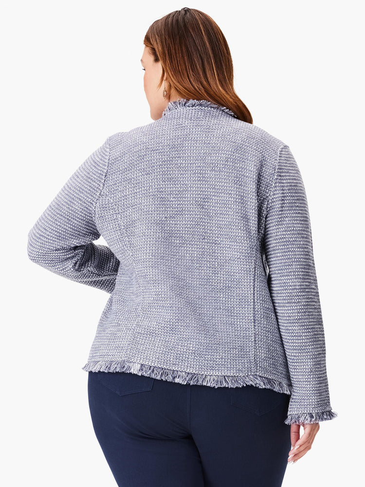 Textured light blue and white knit jacket with fringe along hem, collar, and cuffs. Back view.