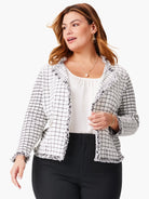 Off-white jacket with black grid pattern and frayed edges.  Pockets visible.