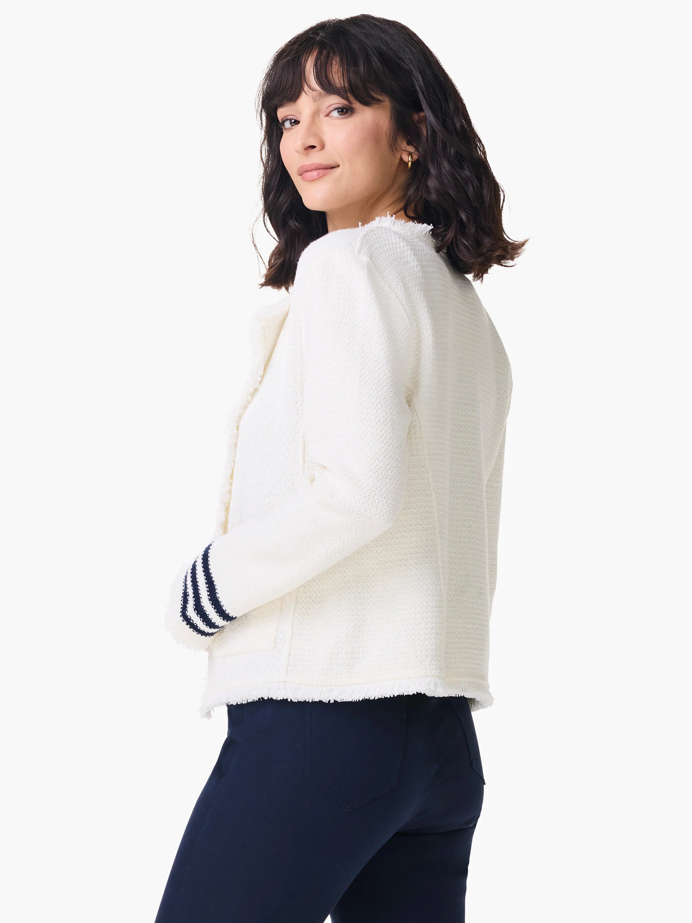 Off-white knit jacket with frayed edges, navy stripes on cuffs.
