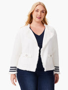 Off-white knit jacket with fringe trim, navy stripes on cuffs.  Small pockets and open front.