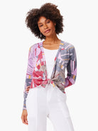 4-way cardigan; purple, red, gray, and beige abstract floral mosaic print.  Front ties at waist. Long sleeves.