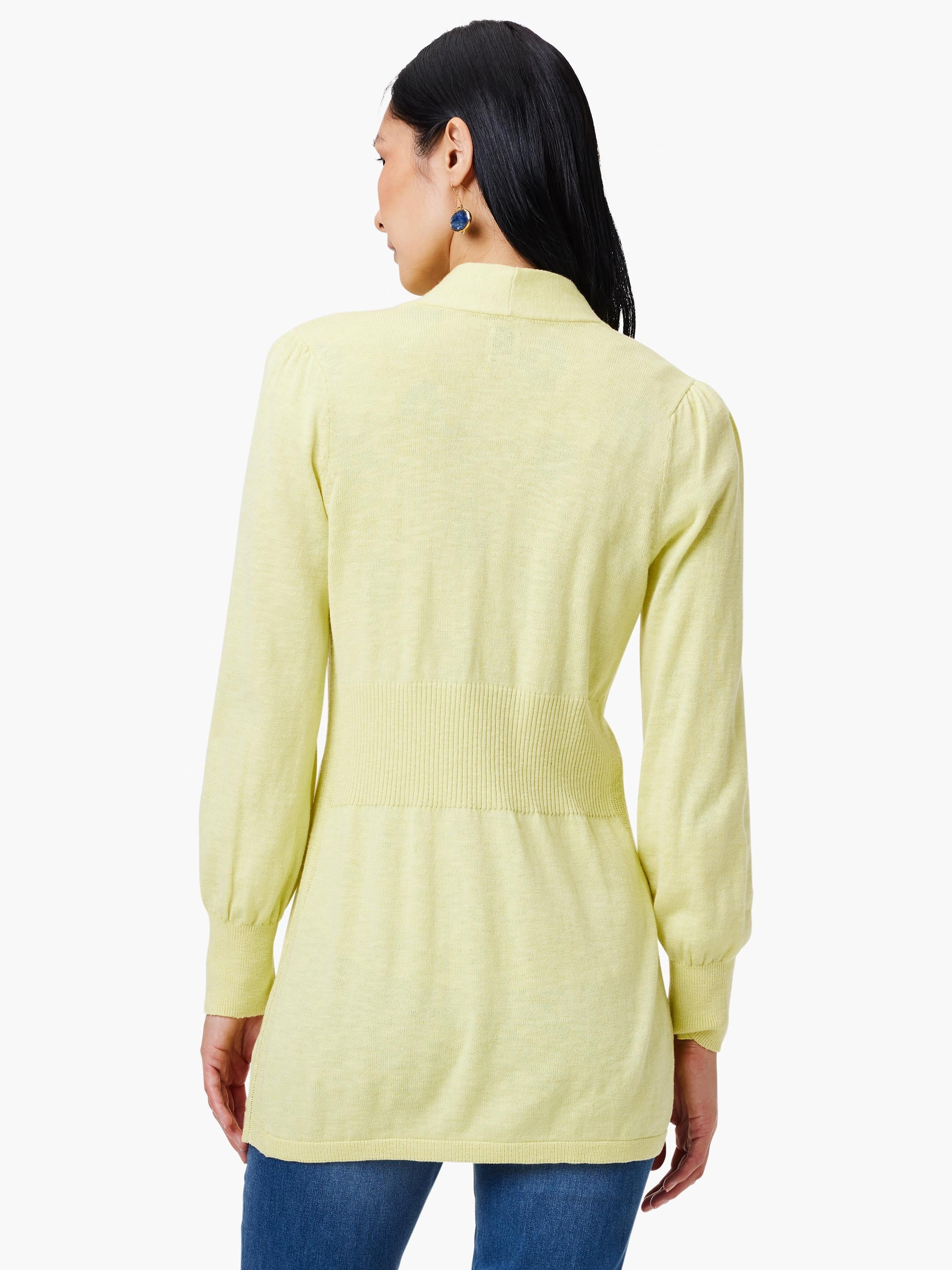 Pale yellow cardigan, long sleeves, fitted waist.  Back view.