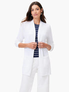 White open cardigan, long sleeves,  patch pockets.