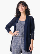 Navy blue open-front mesh cardigan.  Long sleeves, open knit pattern.