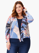 Abstract print 4-way cardigan.  Blues, pinks, grays, and blacks. Open front, long sleeves.