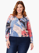 4-way cardigan with abstract blue, pink, coral, and gray print.  Long sleeves, wrap style.