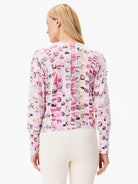 Geo Mosaic Sweater:  Pink, beige, and black geometric pattern on a white background. Long sleeves with puffed shoulders.