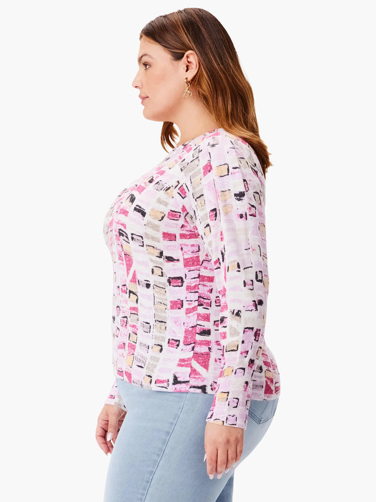 Long-sleeve sweater, white base with pink, beige, and gray geometric mosaic pattern.