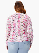 Pink, gray, and beige mosaic-patterned sweater. Long sleeves.  Back view.